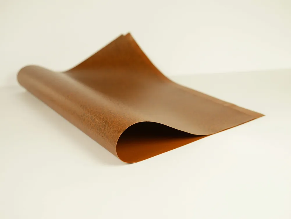 A pliable curl of tan mycelium material